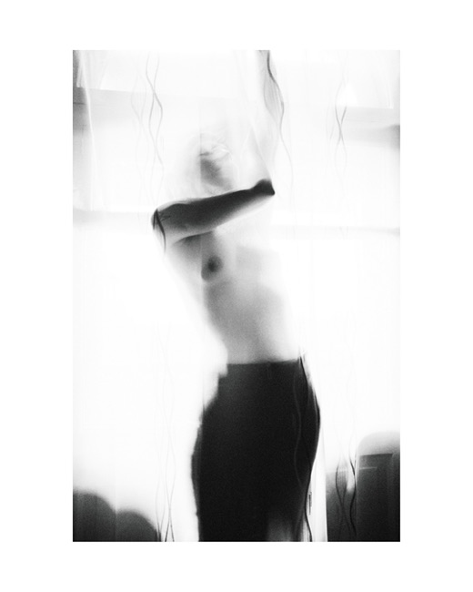 Sirin, photographed by Lilit L Hovhanni — an abstract portrait study, the figure broken up by reflection.